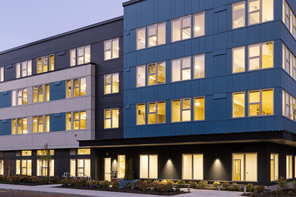 The Kent Supportive Housing building at dusk.